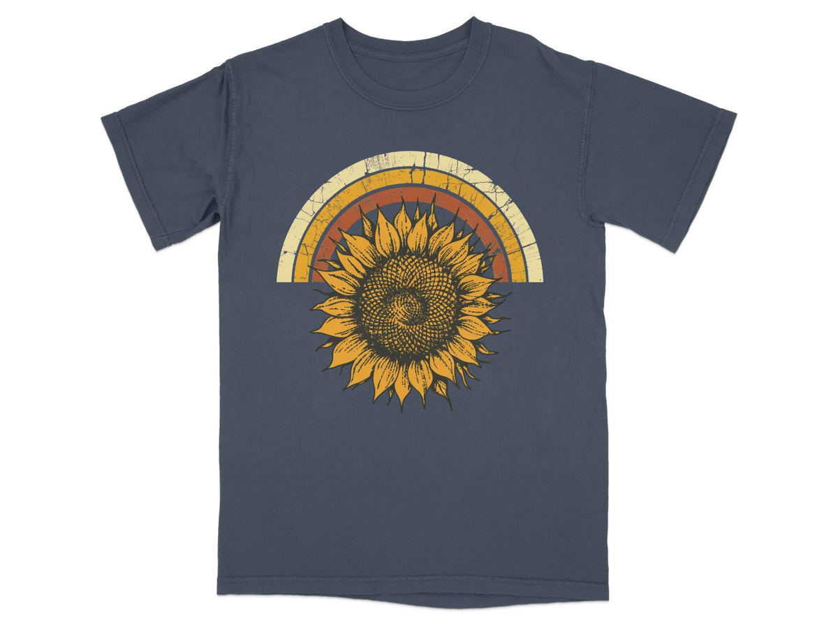 Dark blue t-shirt with a vintage-style sunflower and rainbow graphic.