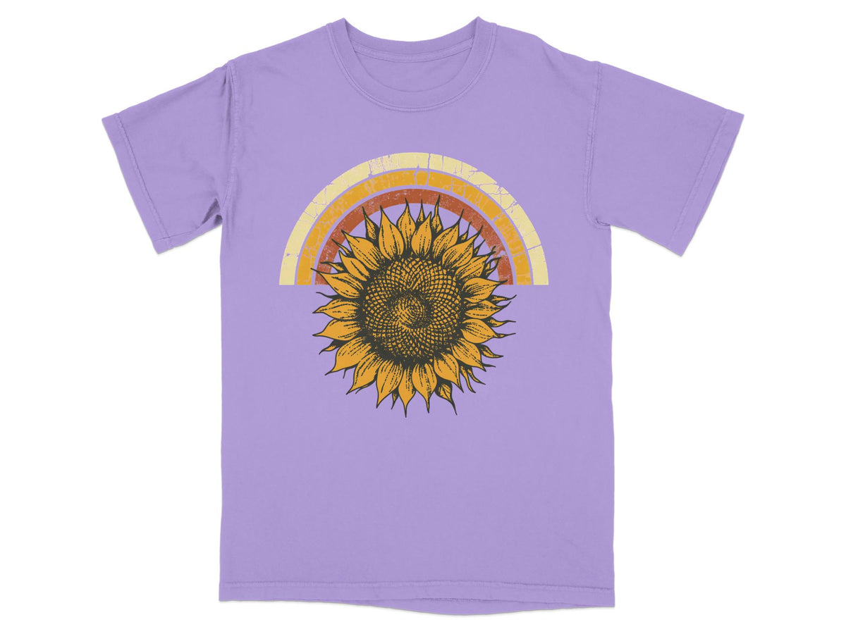 Lavender t-shirt with a distressed sunflower and rainbow graphic.