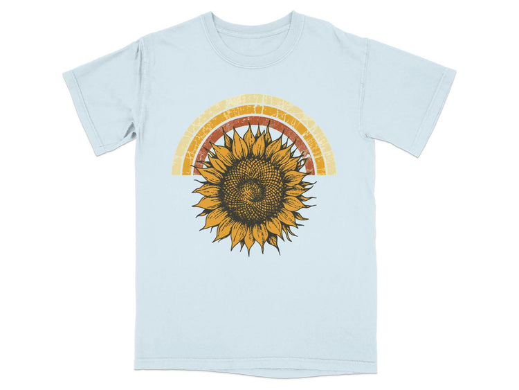Light blue t-shirt with a distressed retro sunflower and rainbow design.