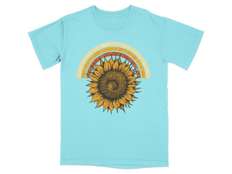 Aqua t-shirt with distressed sunflower and rainbow graphic.