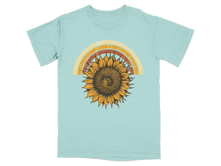 Light blue t-shirt with vintage sunflower and rainbow graphic.
