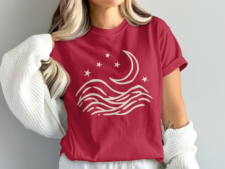 Red shirt with cream crescent moon, stars, and waves design