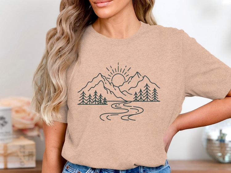 Line art of a mountain range with sun and river on a women's t-shirt.
