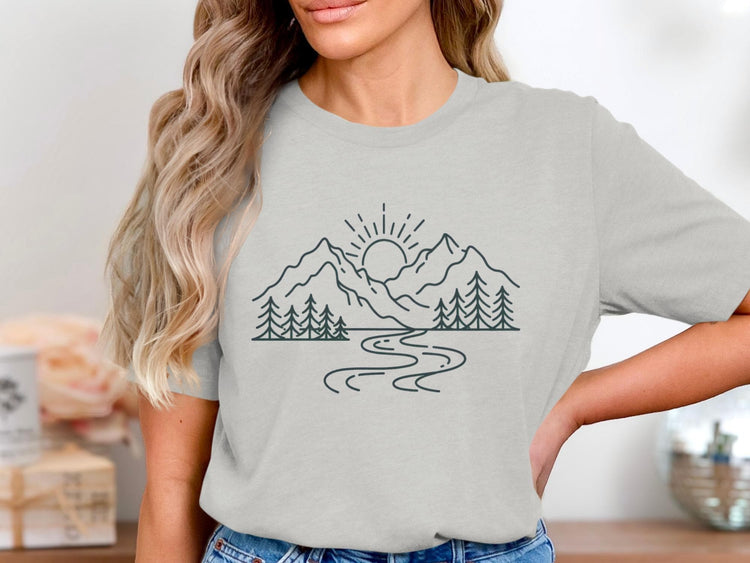 Light grey t-shirt with a dark line drawing of mountains, trees, and a winding river.