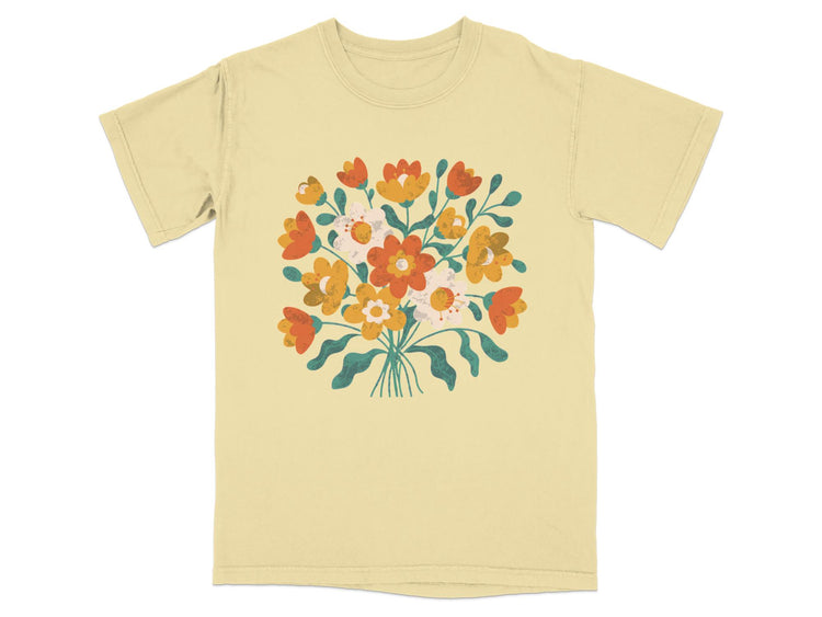 Light yellow t-shirt with a graphic of a colorful, loosely arranged bouquet of flowers.