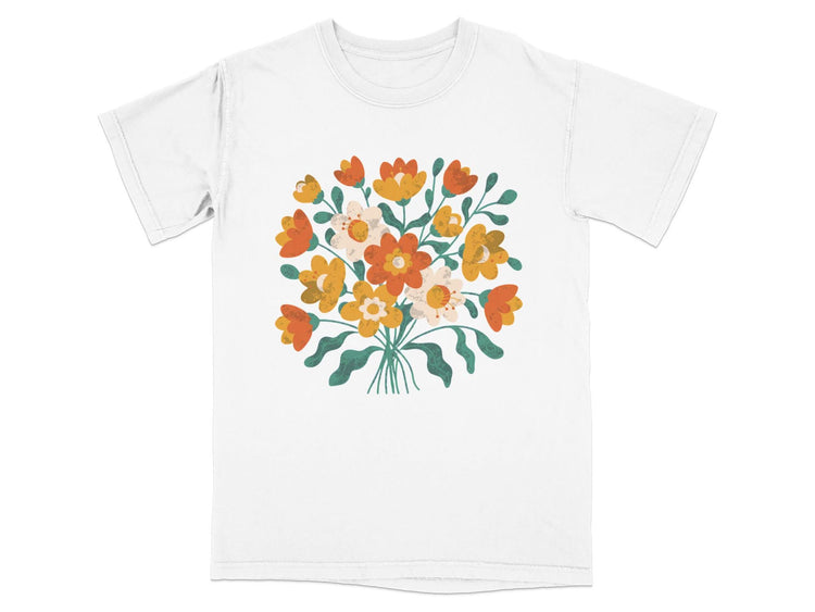 White t-shirt with a bouquet of orange, yellow, and white flowers.