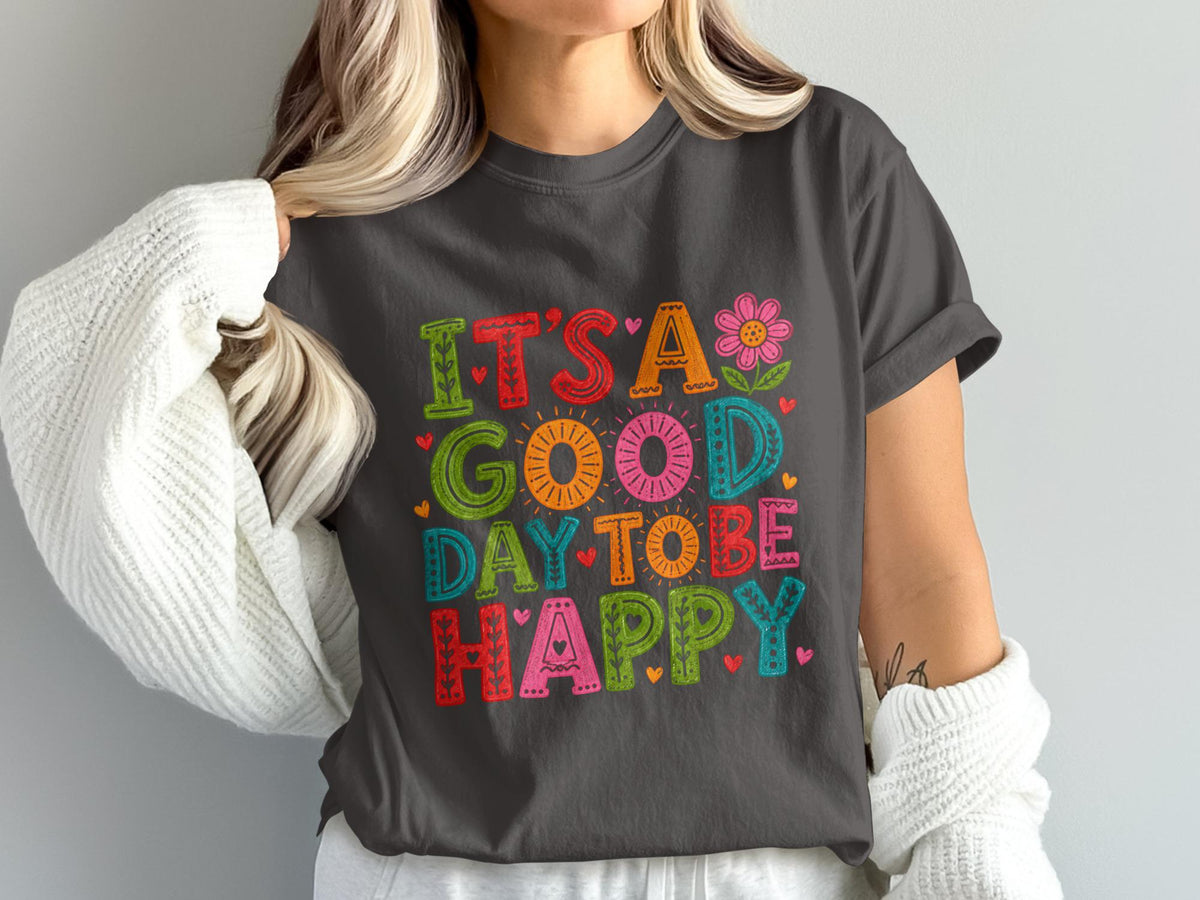 T-shirt with colorful text "IT'S A GOOD DAY TO BE HAPPY" and flower.