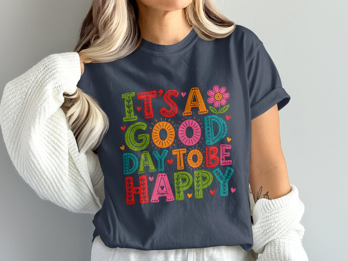 Dark gray t-shirt with colorful text reading "IT'S A GOOD DAY TO BE HAPPY".