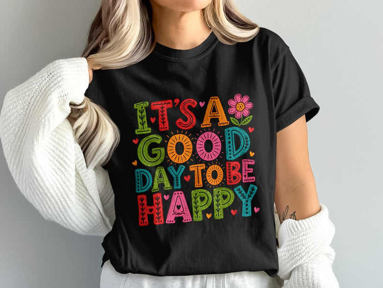 Black t-shirt with text "IT'S A GOOD DAY TO BE HAPPY" in colorful, distressed letters.