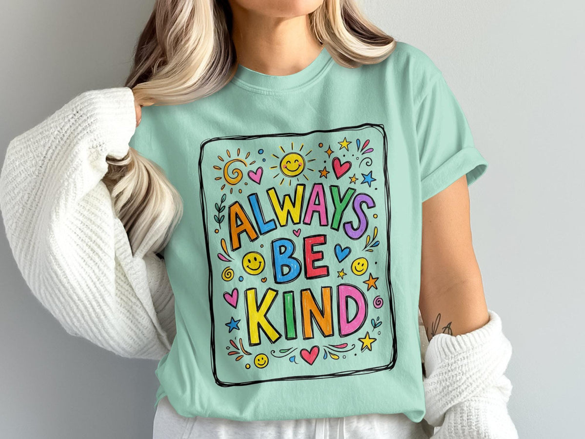 Mint green t-shirt with colorful "Always Be Kind" text and smiling suns.
