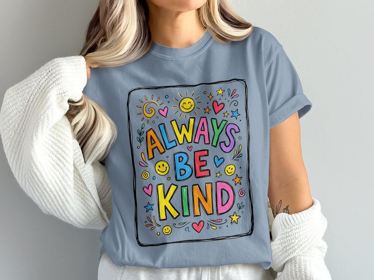 Blue t-shirt with colorful "Always Be Kind" graphic and decorative elements.