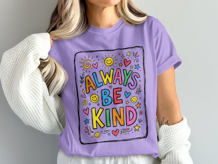 Purple t-shirt with "Always Be Kind" text and colorful drawings.