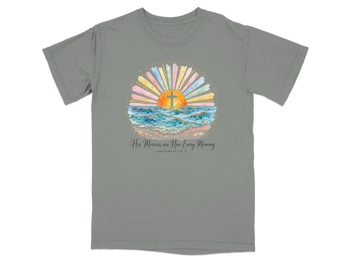 Gray t-shirt with watercolor sunrise, cross, and ocean waves; text "His Mercies are New Every Morning."