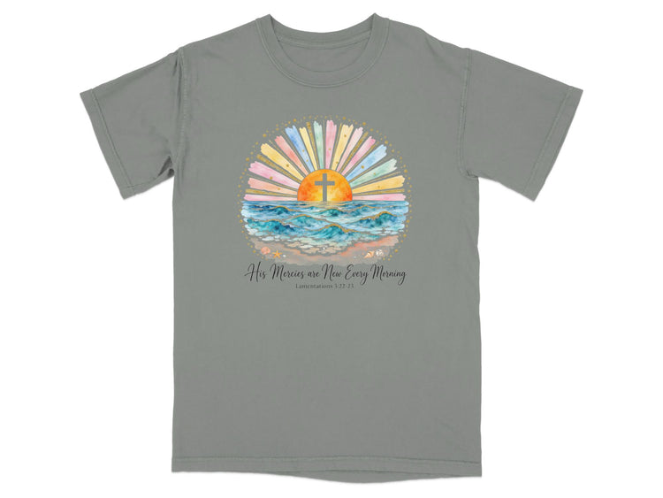 Gray t-shirt with watercolor sunrise, cross, and ocean waves; text "His Mercies are New Every Morning."