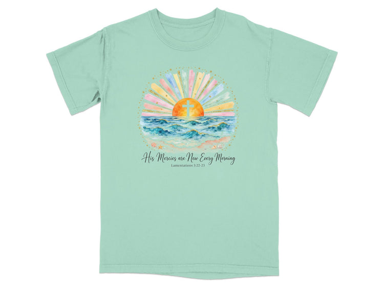 Mint t-shirt with sunrise over ocean, cross, and text "His Mercies are New Every Morning".