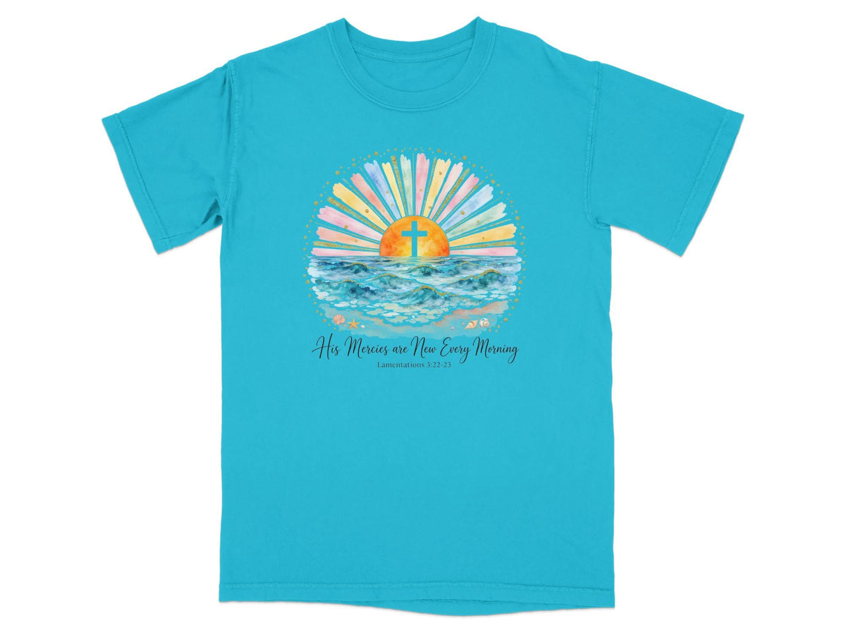 Turquoise t-shirt with sunrise, cross, ocean waves, and text.