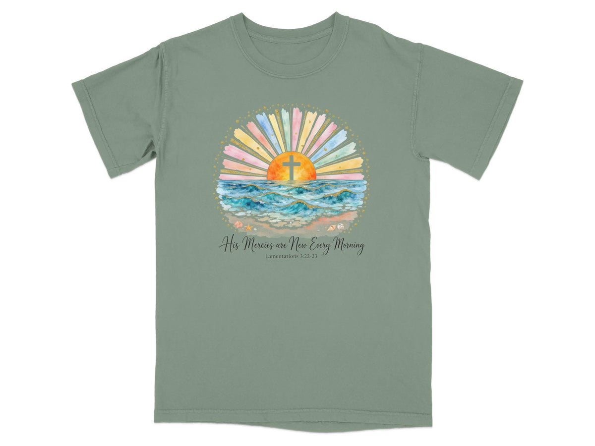 Green t-shirt with watercolor sunrise over ocean, cross graphic, and bible verse.