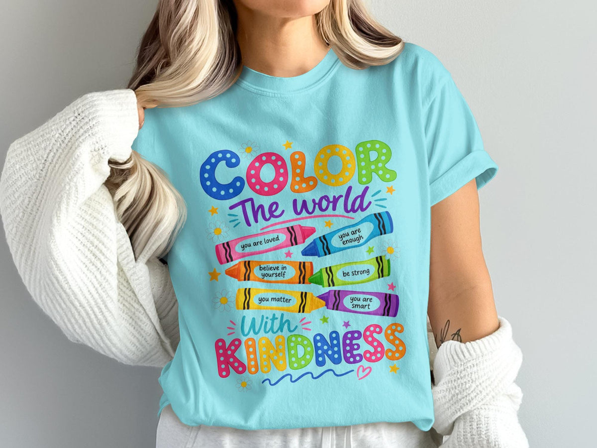 Light blue t-shirt with "COLOR The world With KINDNESS" and inspirational crayon phrases.
