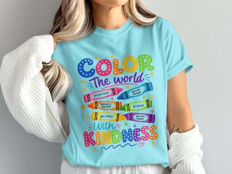 Light blue t-shirt with "COLOR The world With KINDNESS" and inspirational crayon phrases.