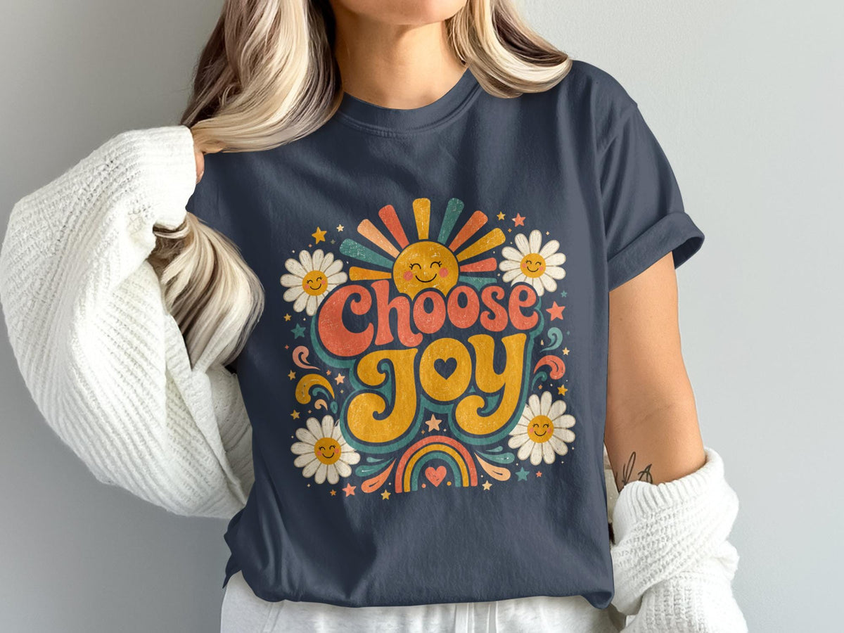 Dark grey t-shirt with "Choose Joy" in retro lettering, sun, daisies, and rainbow design.