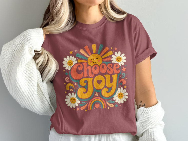 T-shirt with "Choose Joy" text, flowers, sun, and rainbow graphic.