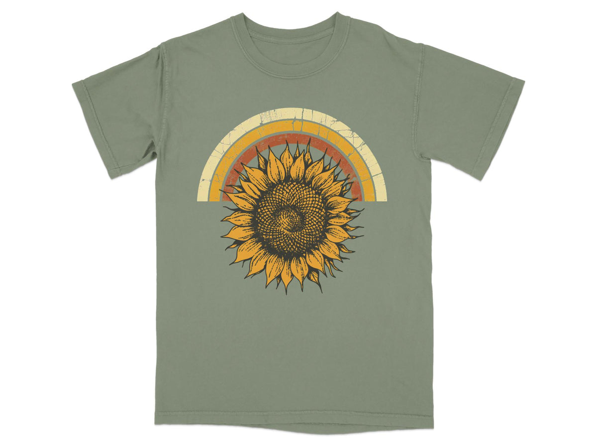 Green t-shirt with distressed rainbow and sunflower graphic.