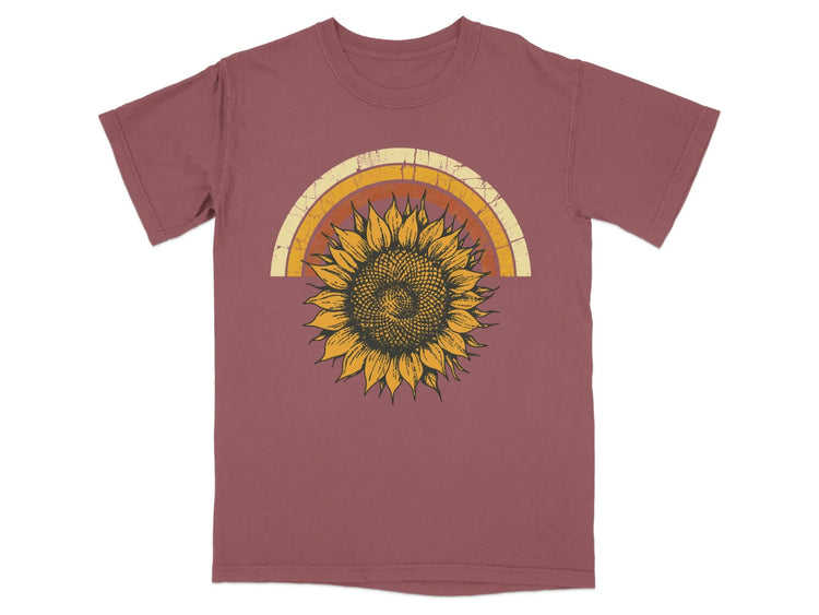 Maroon t-shirt with distressed rainbow arch and a sunflower graphic.