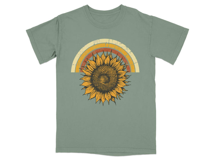 Green t-shirt with a distressed, vintage-style sunflower and rainbow graphic.