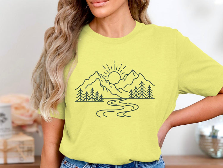 Yellow t-shirt with minimalist mountain, sun, trees, and river graphic.