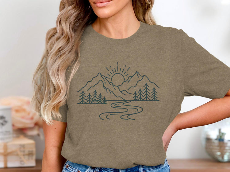 T-shirt with a minimalist mountain, sun, river, and trees graphic.
