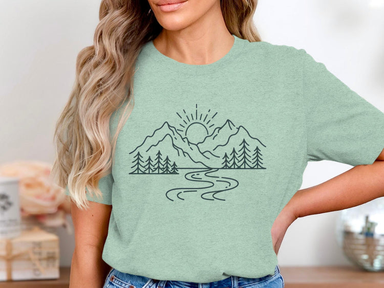 T-shirt with line art of sun, mountains, trees, and a winding river.