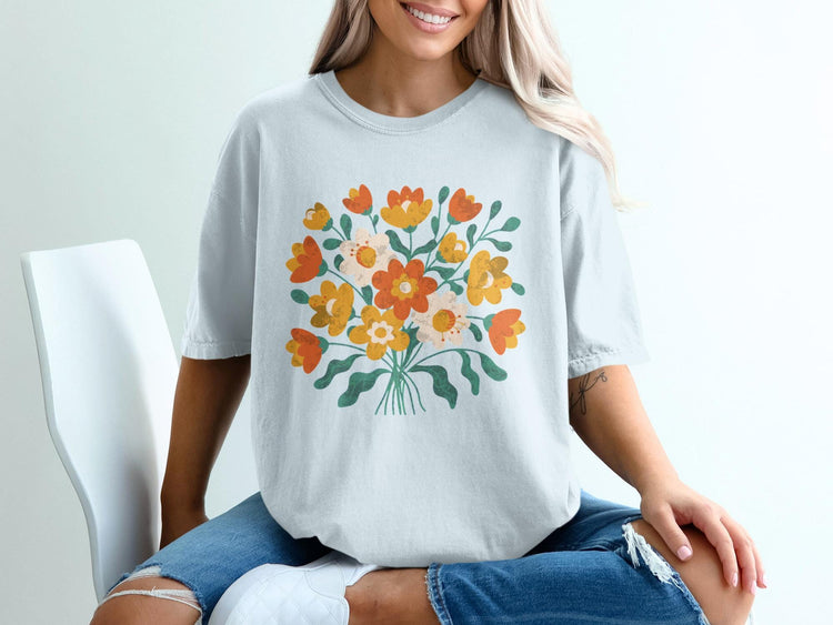 Light blue t-shirt with a colorful bouquet of stylized flowers.