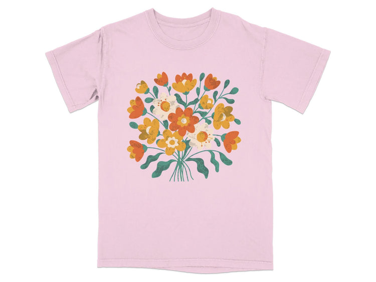 Pink t-shirt with a colorful floral bouquet graphic on the front.