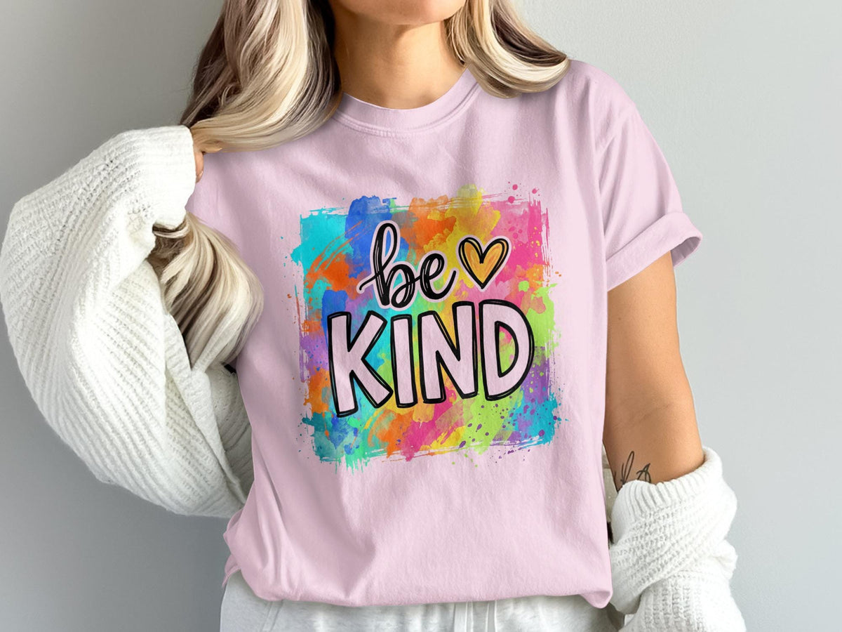 Pink t-shirt with watercolor splash design and "be KIND" text.