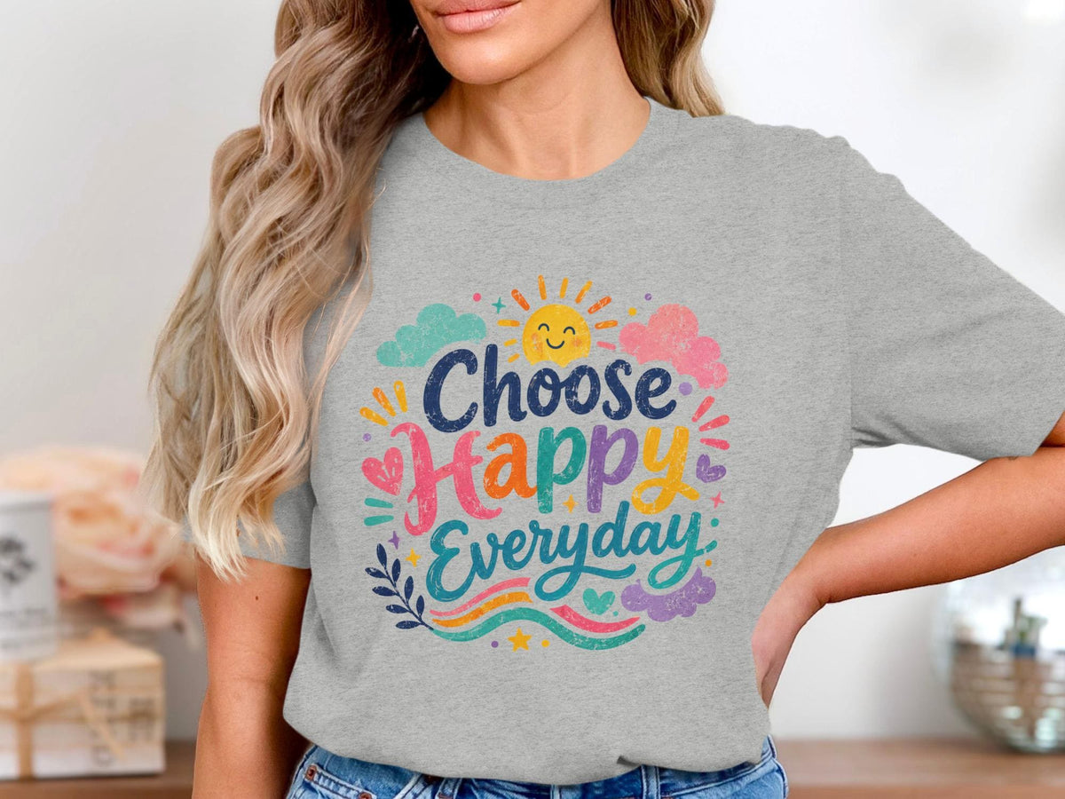 Grey t-shirt with "Choose Happy Everyday" text and cheerful sun and clouds graphic.