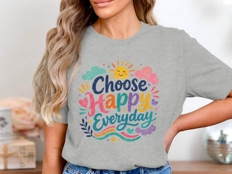 Grey t-shirt with "Choose Happy Everyday" text and cheerful sun and clouds graphic.