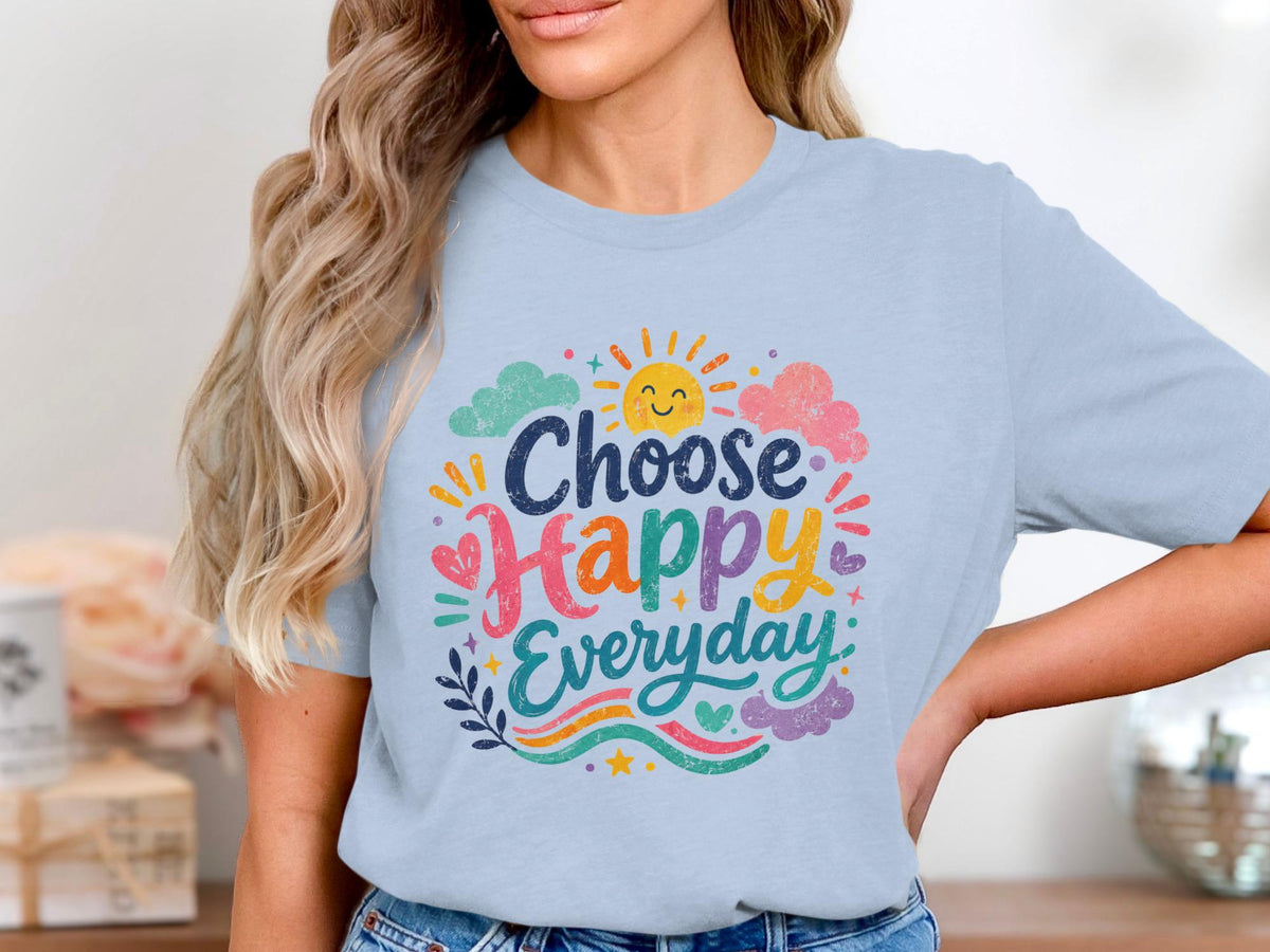 Light blue t-shirt with "Choose Happy Everyday" text and cheerful sun graphic.