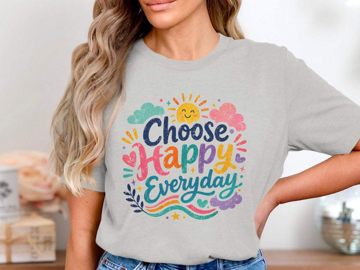Light gray t-shirt with "Choose Happy Everyday" text and sun, clouds, hearts, and waves.