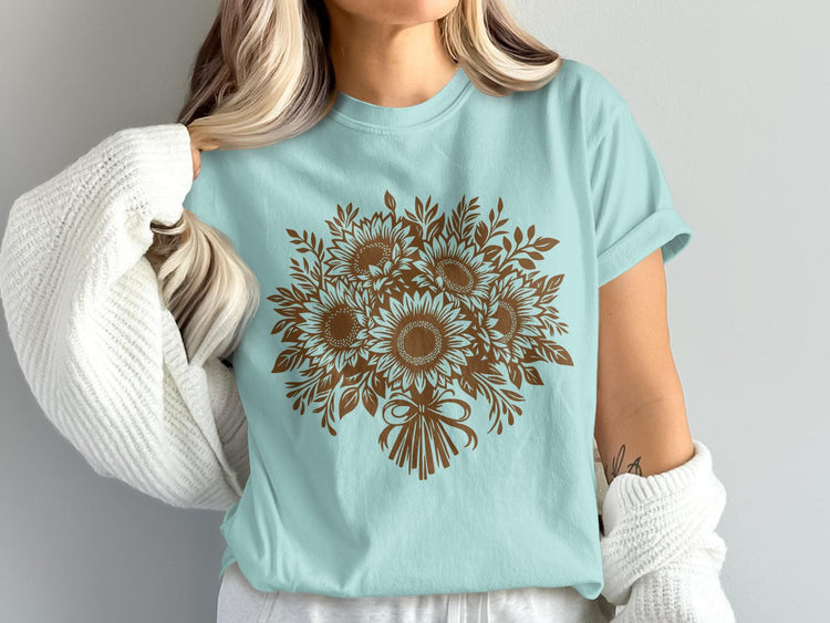 Light blue t-shirt with brown sunflower bouquet graphic and bow.