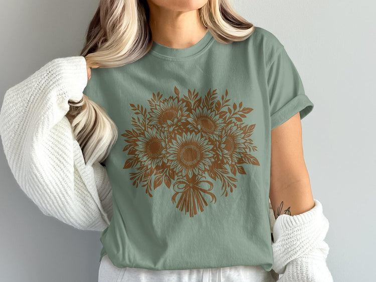 Sage green t-shirt with a brown sunflower bouquet graphic and bow.