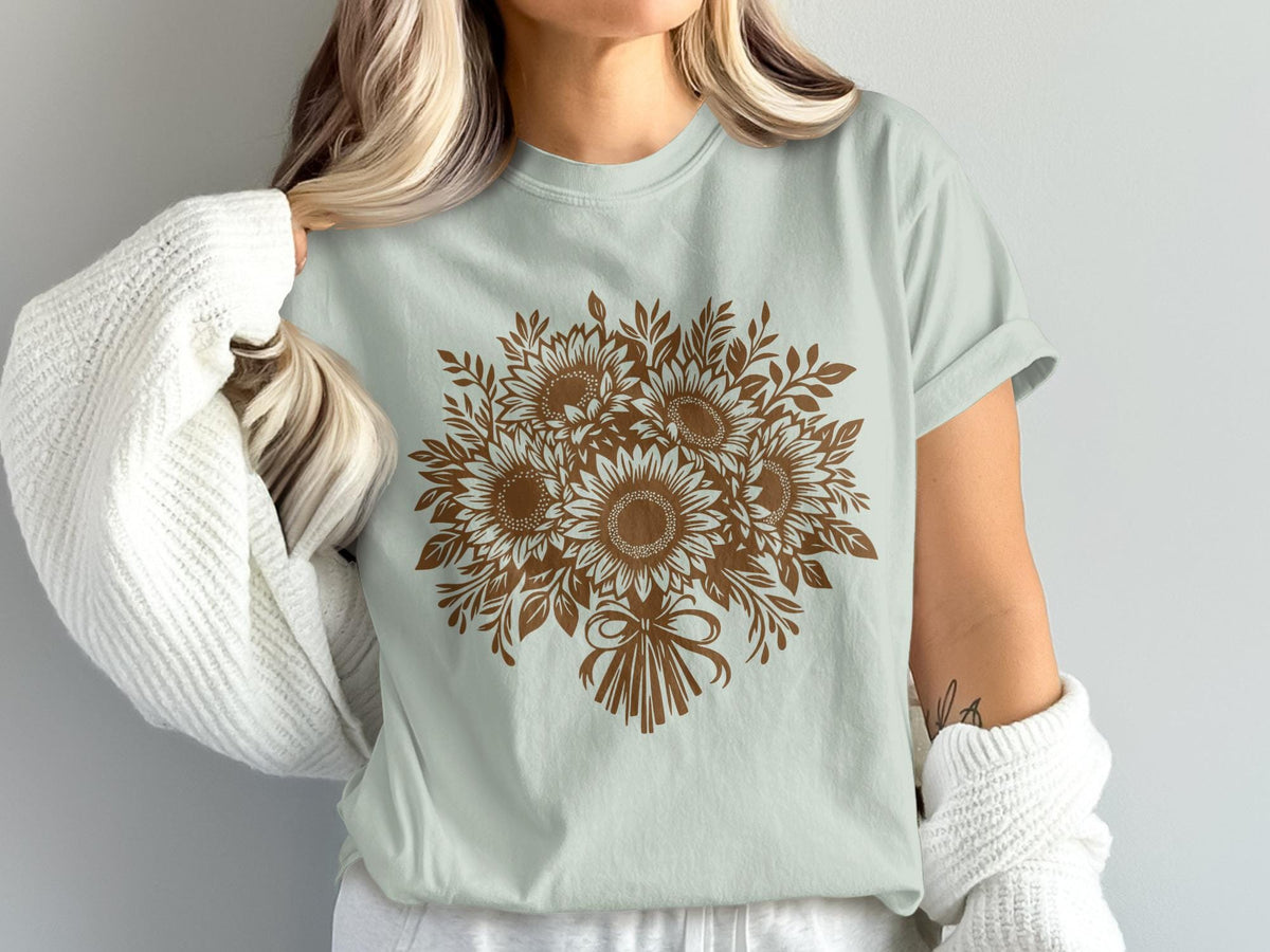 Light blue t-shirt with brown sunflower bouquet graphic and bow.