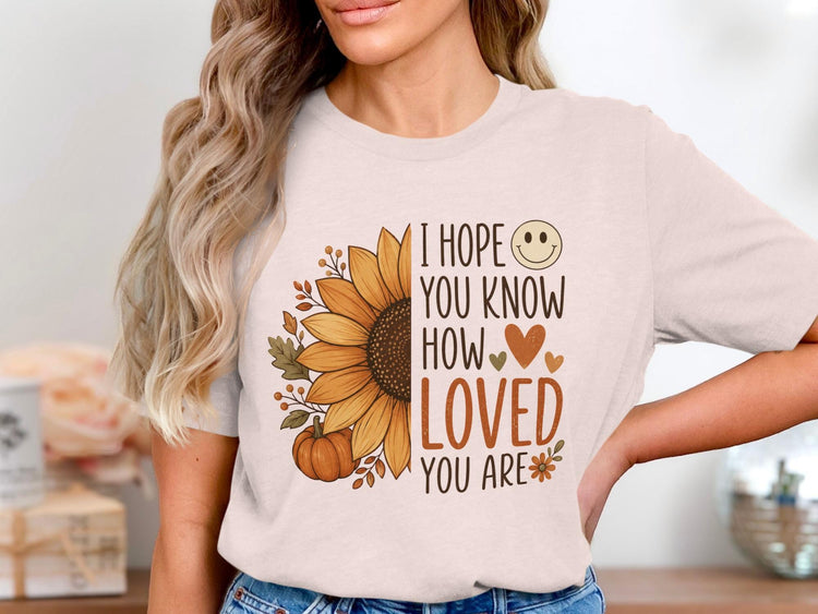 I hope you know how loved you are text with sunflower, pumpkin, and leaves graphic.