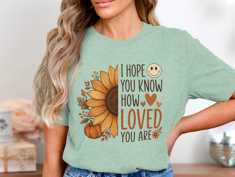 Mint t-shirt with sunflower, pumpkin, and text "I hope you know how loved you are".