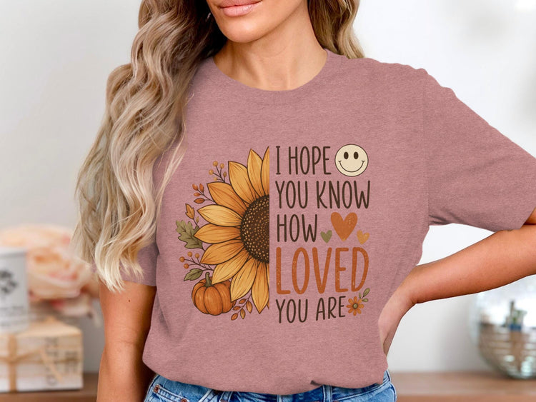 T-shirt with sunflower, pumpkin, and text "I hope you know how loved you are".
