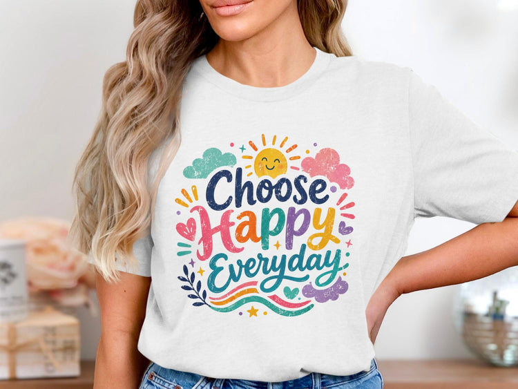 White t-shirt with "Choose Happy Everyday" graphic featuring a sun, clouds, hearts, and waves.