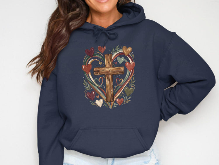 Navy hoodie with a wooden cross surrounded by a heart of colorful hearts and leaves.
