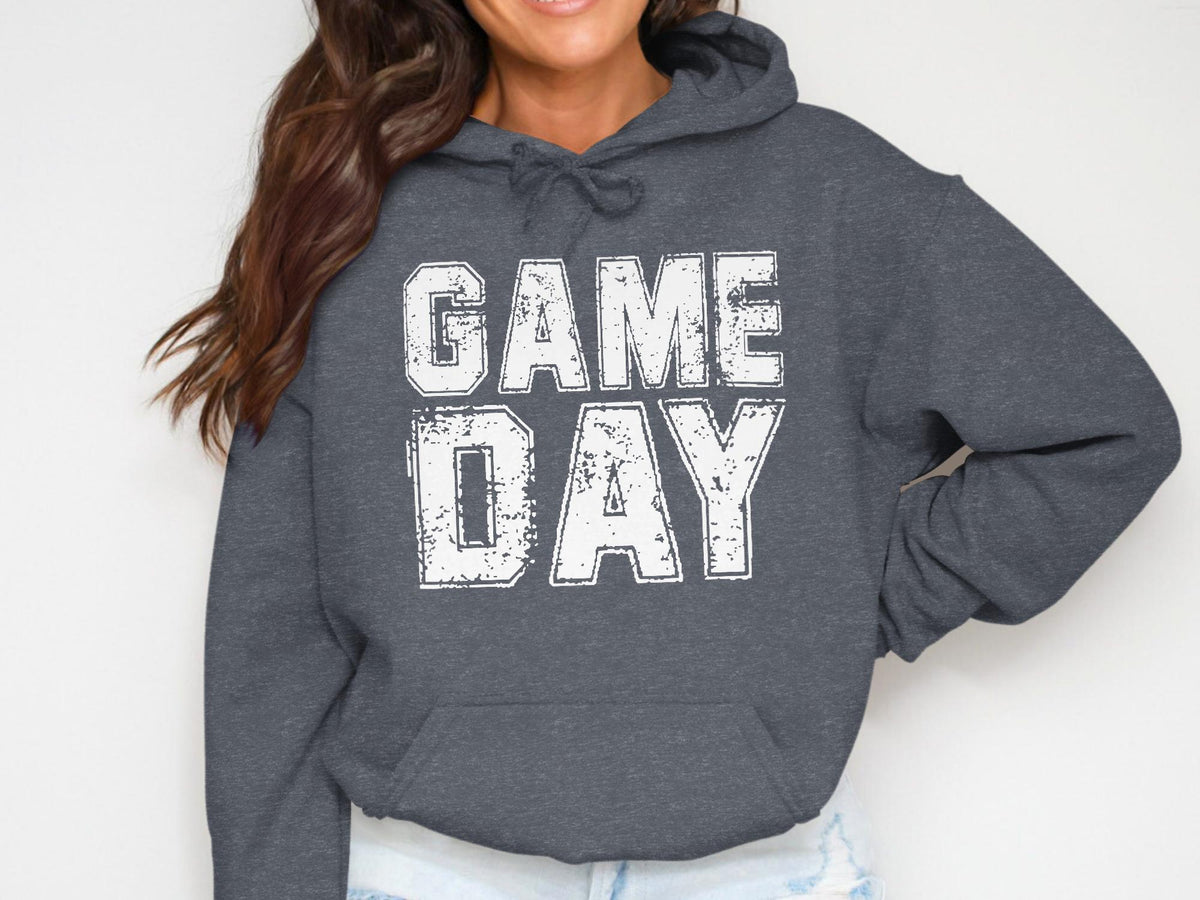 Dark grey hoodie with white distressed text reading "GAME DAY"