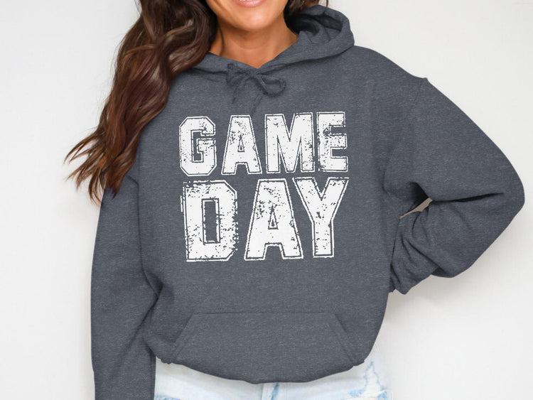 Dark grey hoodie with white distressed text reading "GAME DAY"