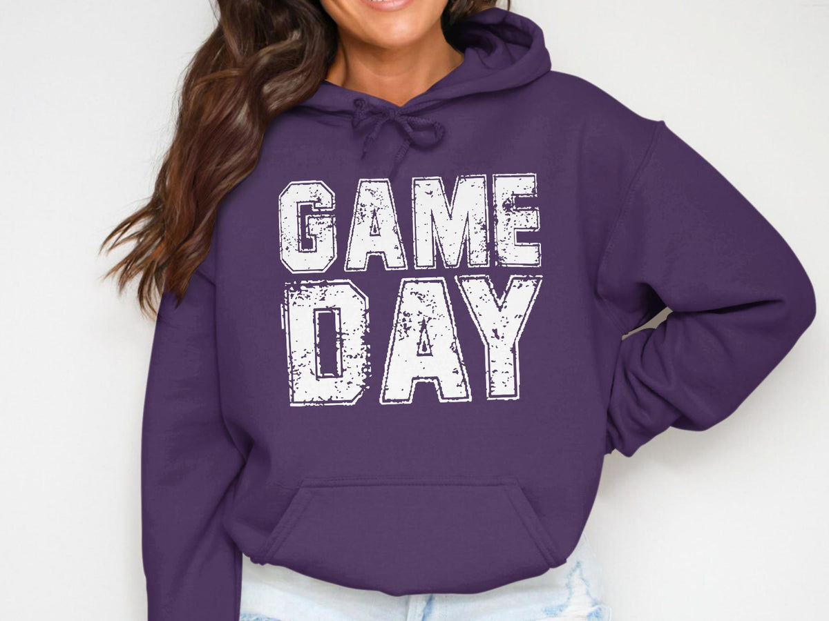 Purple hoodie with white distressed "GAME DAY" graphic across chest.