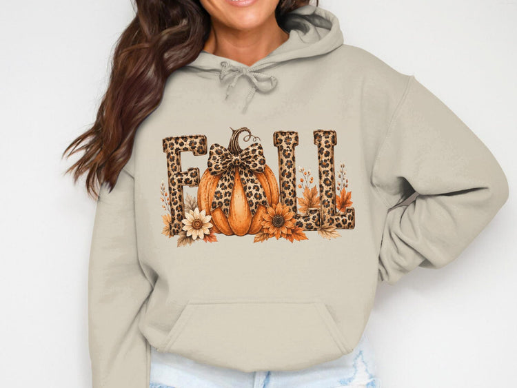 Light tan hoodie with "Fall" text, pumpkin, sunflowers, and leopard print accents.
